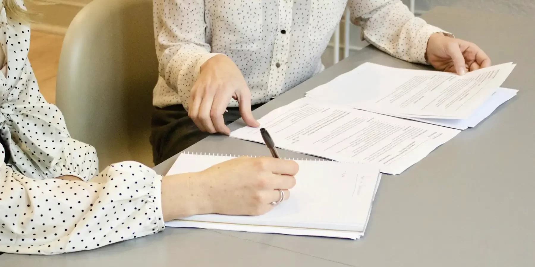 Realtor reviewing invoice from transaction coordinator